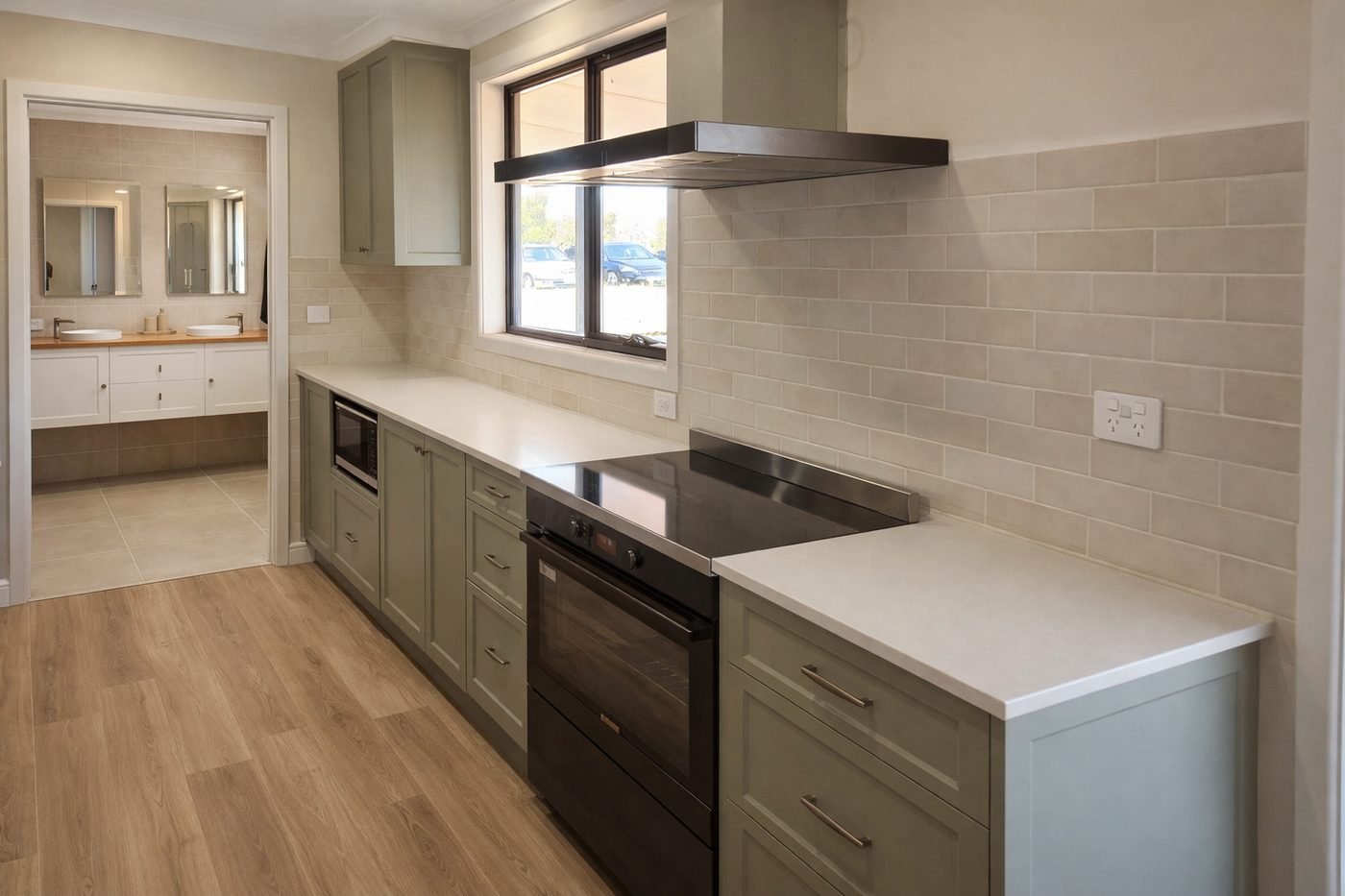 Modern kitchen renovation with stone benchtop and custom cabinetry